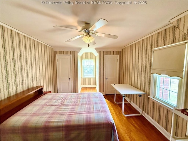 bedroom with hardwood / wood-style floors and ceiling fan