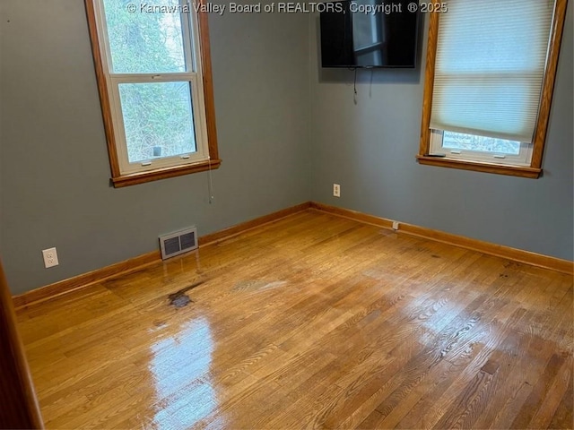 unfurnished room featuring wood-type flooring