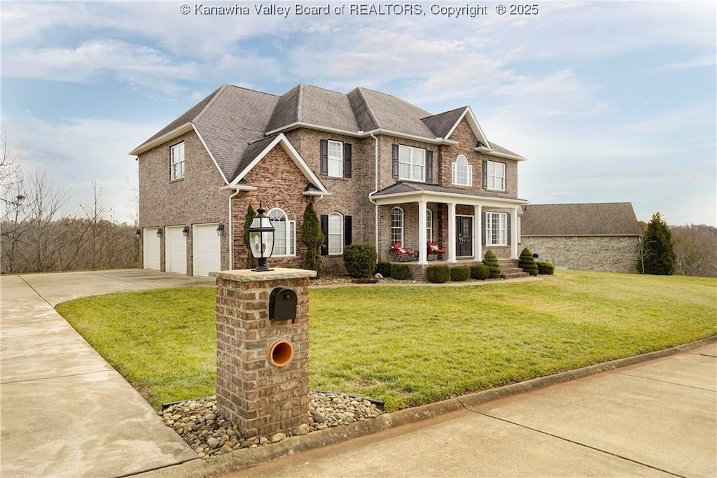 view of front of home featuring a garage and a front yard