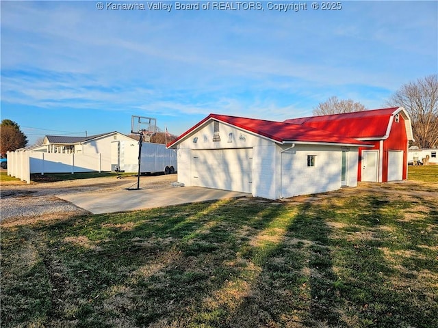 view of outbuilding featuring a lawn