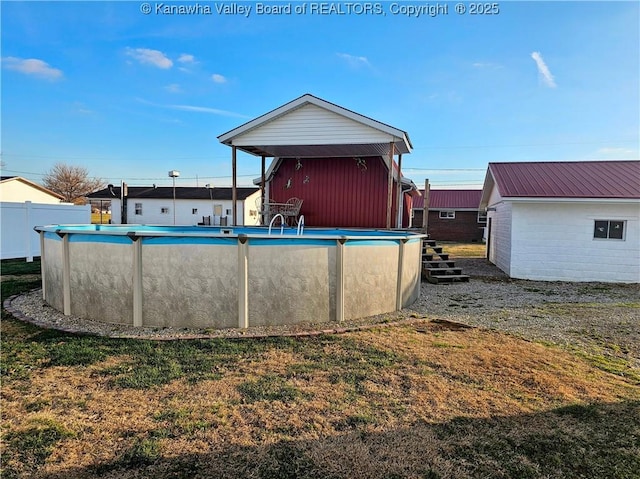 back of property featuring a yard