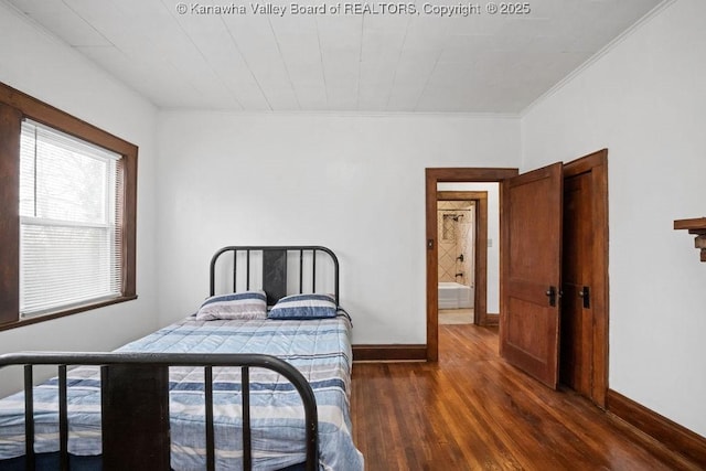 bedroom featuring ornamental molding and dark hardwood / wood-style flooring