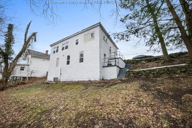 view of side of property with cooling unit