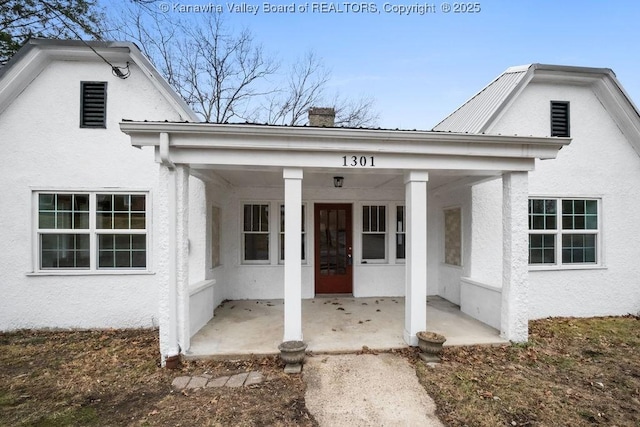 entrance to property with a porch