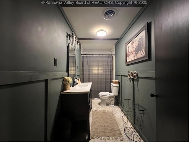 bathroom with vanity and toilet