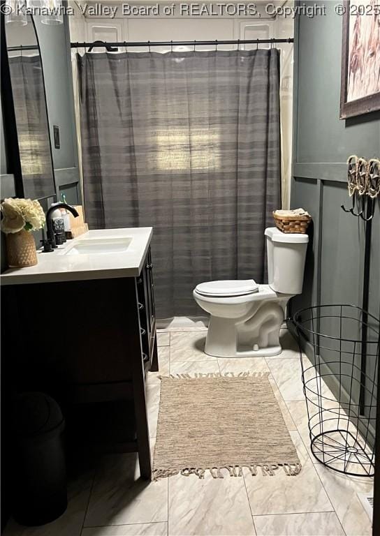 bathroom featuring vanity and toilet