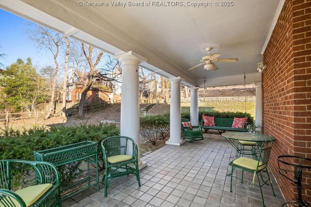 view of patio / terrace featuring ceiling fan