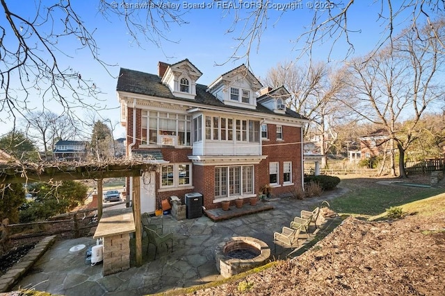 back of house featuring a sunroom, central AC unit, and a patio