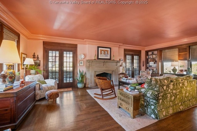 living room with ornamental molding, dark parquet flooring, and french doors