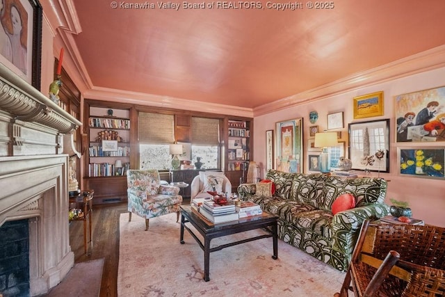 living room with hardwood / wood-style flooring and ornamental molding