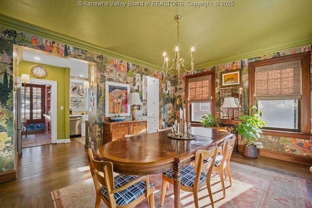 dining space featuring a notable chandelier, dark wood-type flooring, and ornamental molding