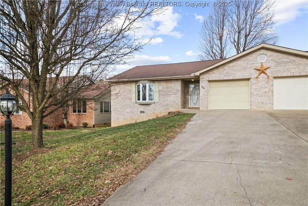 single story home featuring a garage and a front lawn