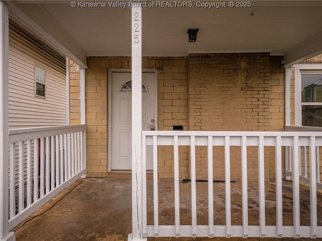 property entrance featuring covered porch