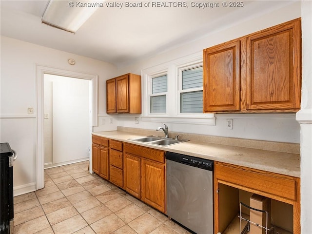 kitchen featuring sink, light tile patterned floors, and stainless steel dishwasher