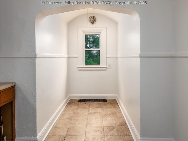 spacious closet featuring light tile patterned floors