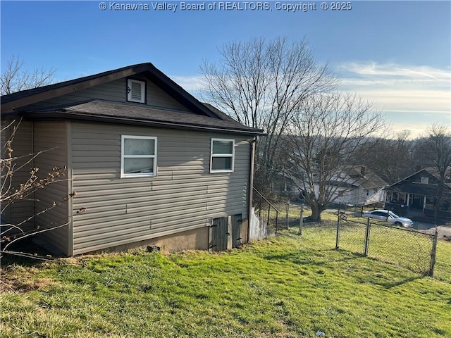 view of property exterior with a yard