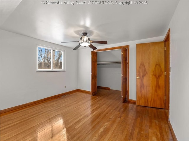 unfurnished bedroom featuring ceiling fan and light hardwood / wood-style flooring