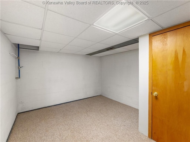 basement featuring a paneled ceiling