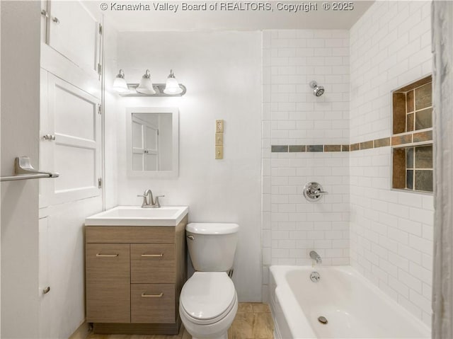 full bathroom featuring vanity, toilet, and tiled shower / bath combo