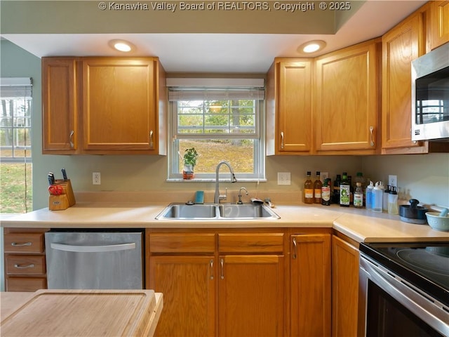 kitchen featuring appliances with stainless steel finishes and sink