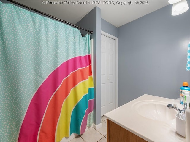 bathroom featuring tile patterned flooring and vanity