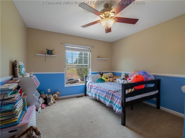 carpeted bedroom with ceiling fan