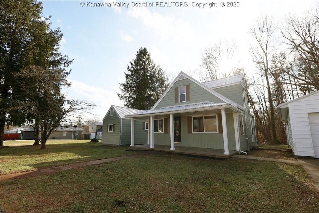 view of front facade with covered porch and a front lawn