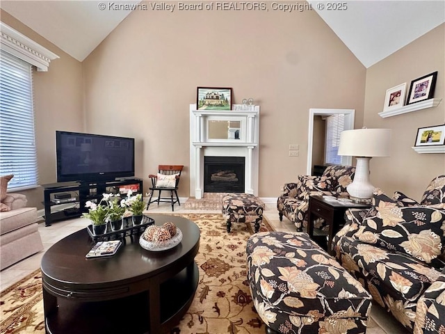 living room with a wealth of natural light and high vaulted ceiling