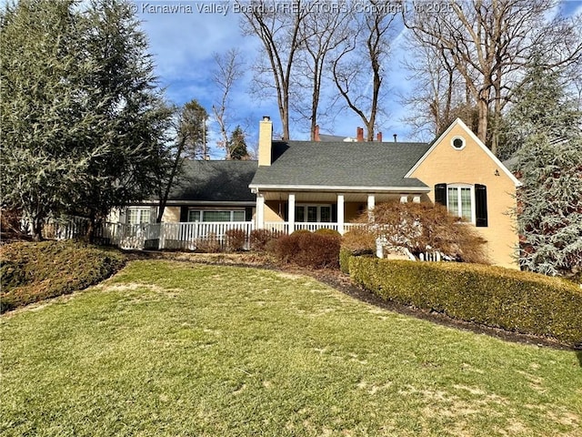 view of front facade with a porch and a front yard