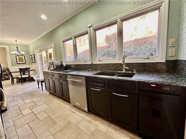 kitchen with french doors, sink, decorative light fixtures, dark brown cabinets, and ornamental molding