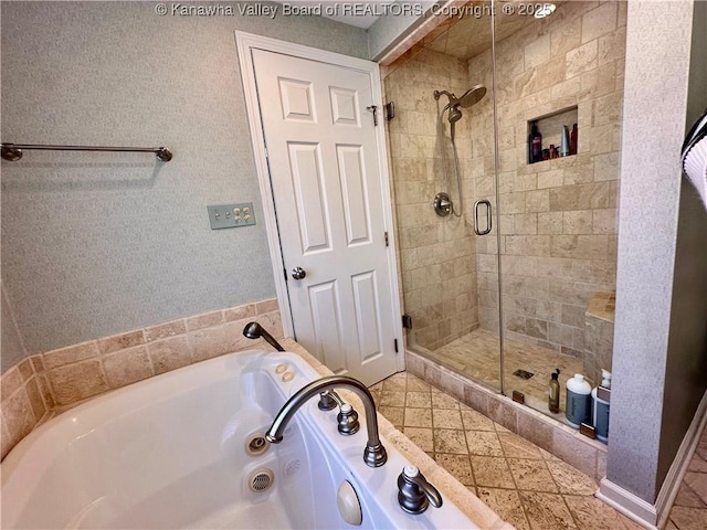 bathroom with separate shower and tub