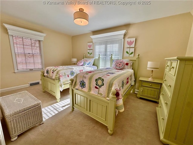 bedroom featuring multiple windows and light carpet