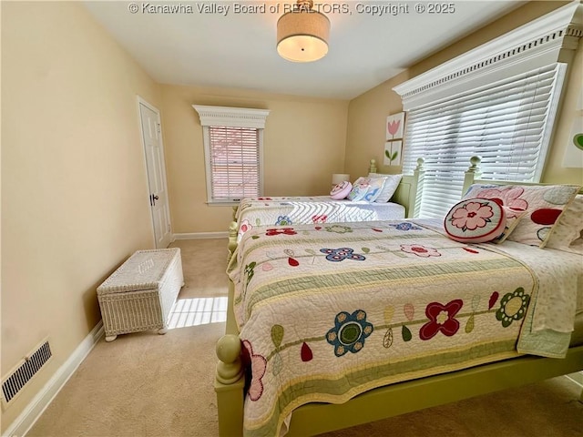 bedroom with light carpet