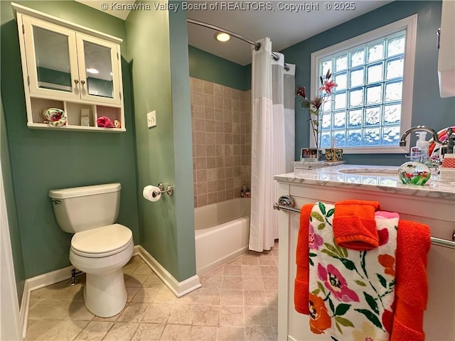 full bathroom with tile patterned flooring, shower / bath combo, vanity, and toilet