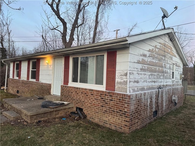 view of home's exterior featuring a yard