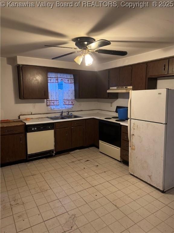 kitchen featuring sink, white appliances, dark brown cabinets, and ceiling fan