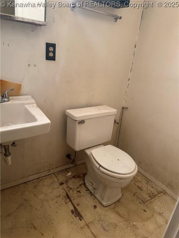 bathroom with sink and toilet