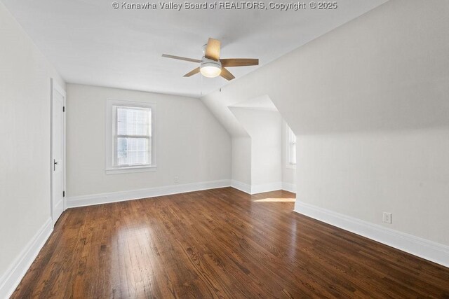 bonus room featuring lofted ceiling, dark wood-type flooring, and ceiling fan