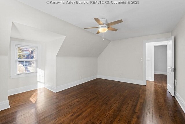 additional living space with dark wood-type flooring, ceiling fan, and lofted ceiling