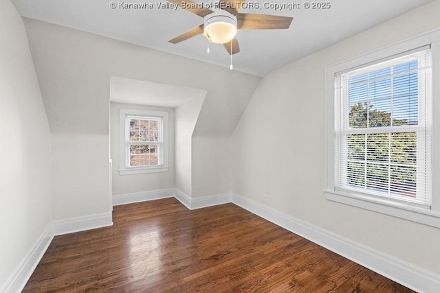 bonus room with dark wood-type flooring, ceiling fan, and lofted ceiling