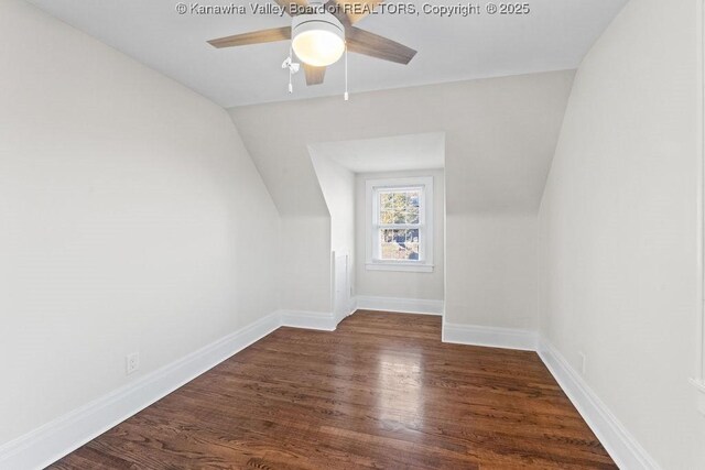 bonus room with ceiling fan, lofted ceiling, and dark hardwood / wood-style flooring