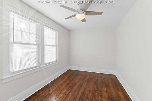 unfurnished room with dark wood-type flooring and ceiling fan