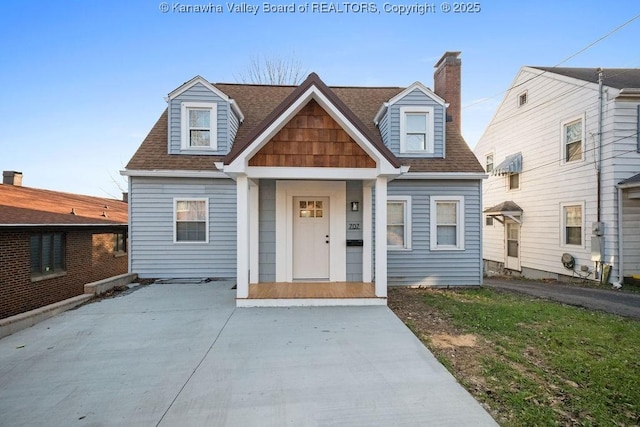 view of front of house with roof with shingles