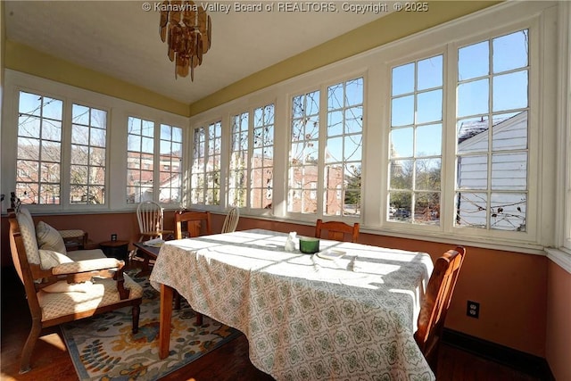 sunroom / solarium featuring a healthy amount of sunlight