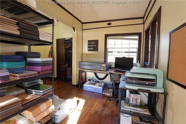 office space with dark wood-type flooring and ornamental molding