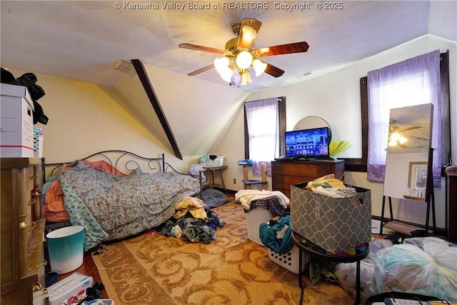 bedroom featuring vaulted ceiling and ceiling fan