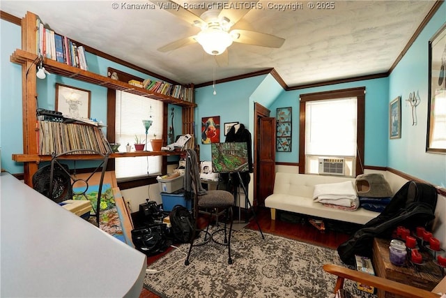 living area featuring hardwood / wood-style flooring, crown molding, cooling unit, and ceiling fan