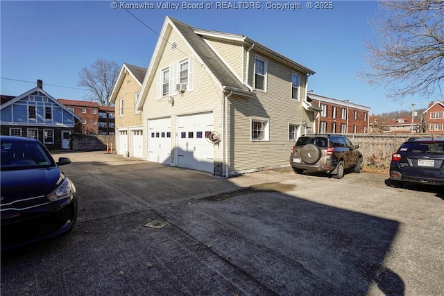 view of side of home with a garage