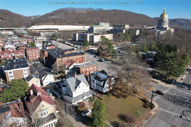 drone / aerial view featuring a mountain view