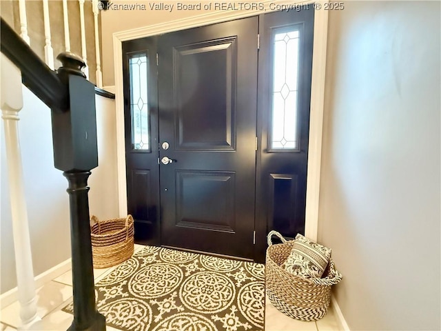 doorway to outside featuring light tile patterned flooring